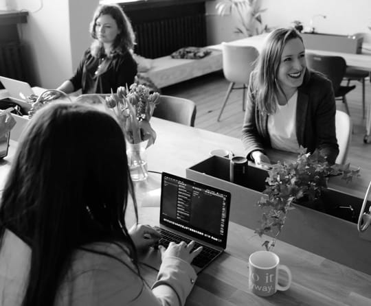 Image of people sitting at computers