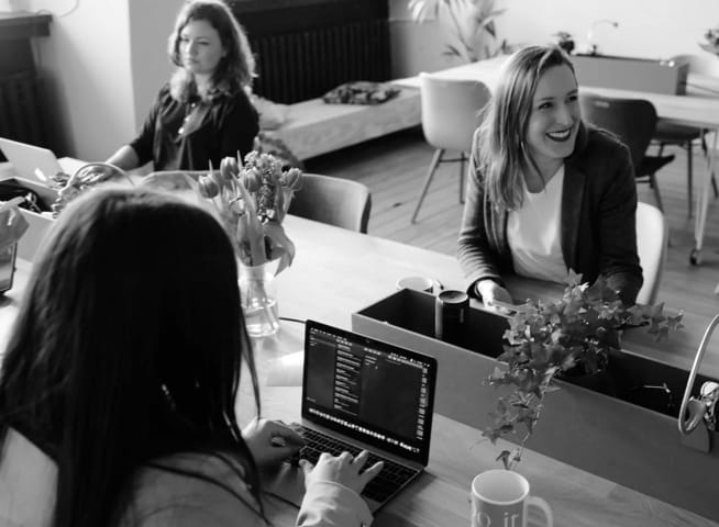 Image of people sitting at computers